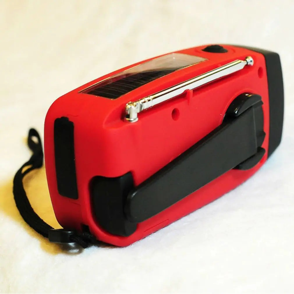 Solar hand crank USB charging radio flashlight Towed To Adventure