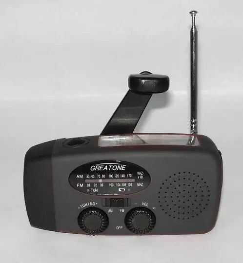 Solar hand crank USB charging radio flashlight Towed To Adventure