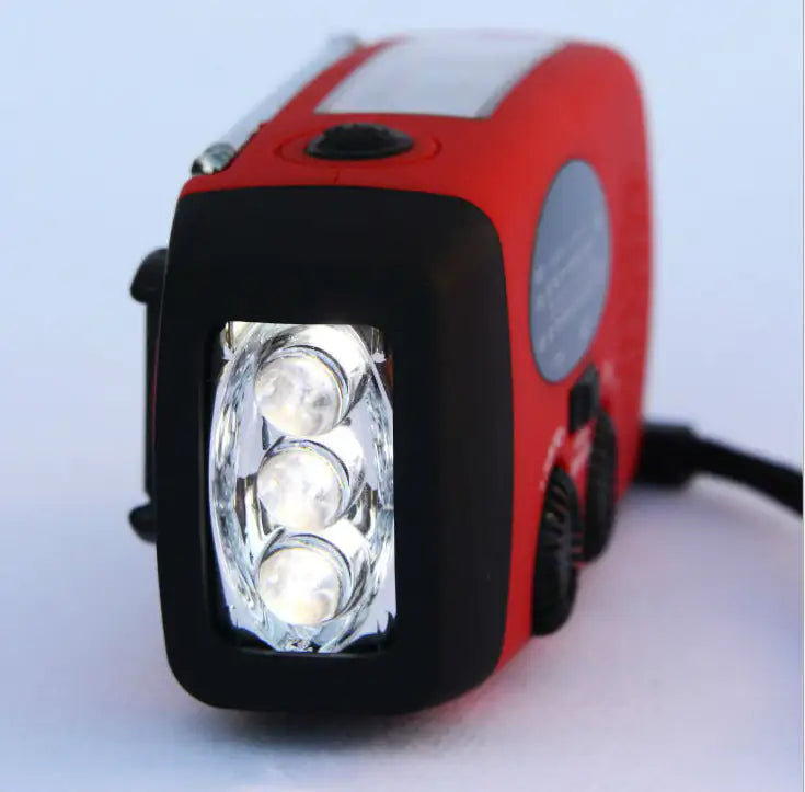 Solar hand crank USB charging radio flashlight Towed To Adventure